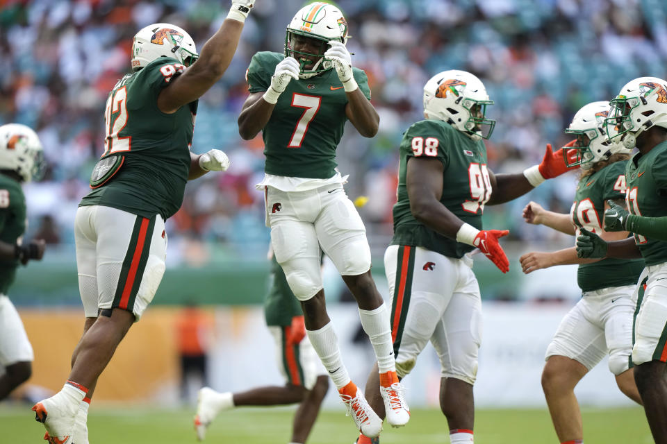 Florida A&M defensive back Tevin Griffey (7) celebrates with defensive lineman Gentle Hunt (92) after making a play during the second half of the Orange Blossom Classic NCAA college football game against Jackson State, Sunday, Sept. 3, 2023, in Miami Gardens, Fla. (AP Photo/Lynne Sladky)