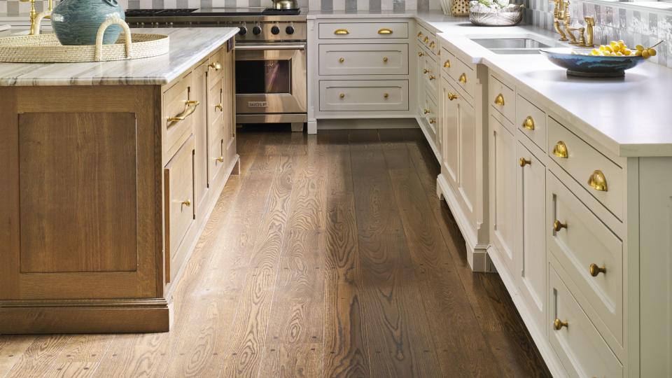 the kitchen’s chic checkerboard backsplash is fashioned out of glazed terra cotta tile