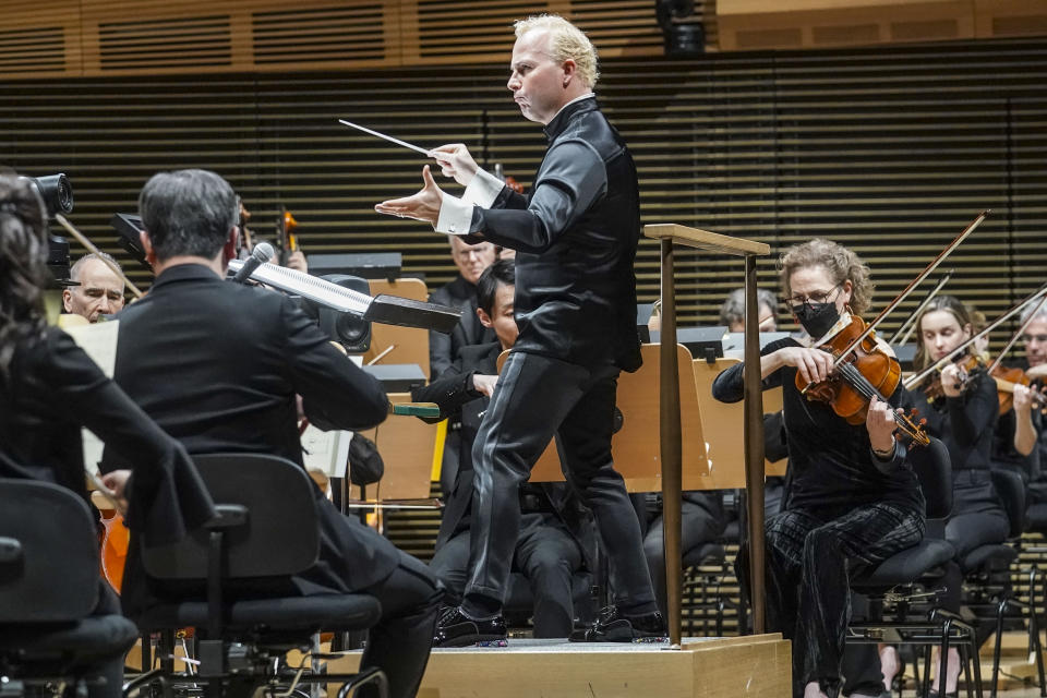 Metropolitan Opera's new music director Yannick Nézet-Séguin, center, debut as conductor of the New York Philharmonic, performing Leonard Bernstein's music from Bradley Cooper's movie "Maestro," Wednesday, Feb. 14, 2024, in New York. (AP Photo/Bebeto Matthews)