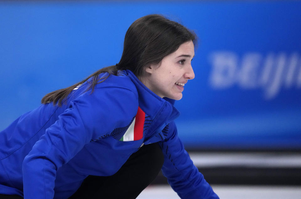 Italy's Stefania Constantini, directs her teammate, during the mixed doubles semi-finals against Sweden, at the 2022 Winter Olympics, Monday, Feb. 7, 2022, in Beijing. (AP Photo/Nariman El-Mofty)