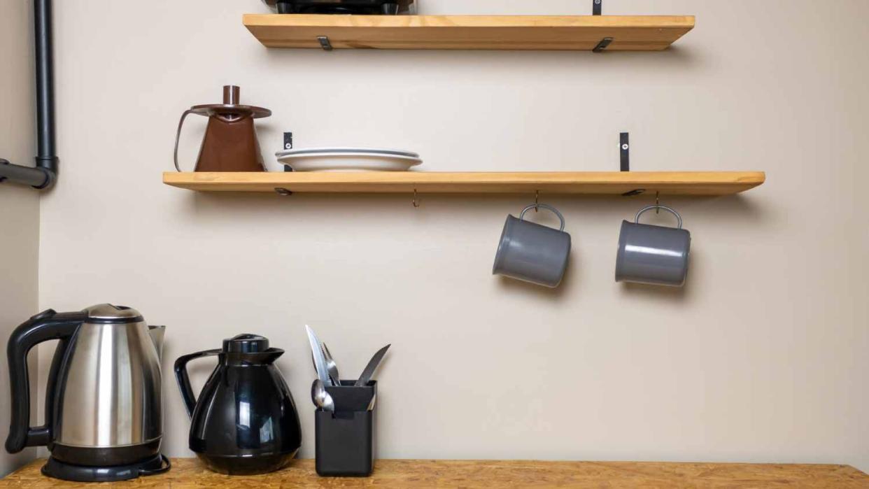 Small table for breakfast with a toaster hanging mugs