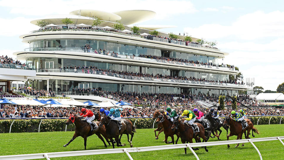 Horses racing down the straight at Flemington during the Melbourne Cup.