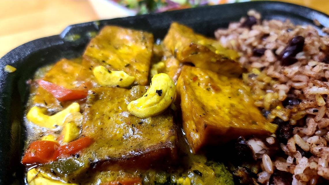 Coconut Curry Tofu with rice and beans served with a vegetable salad and plantains from Roots Plant Based Cafe in Byron.