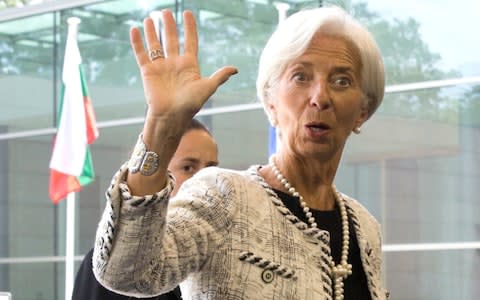 Managing Director of the International Monetary Fund Christine Lagarde waves as she arrives for a meeting of eurogroup finance ministers at EU headquarters in Luxembourg - Credit: AP