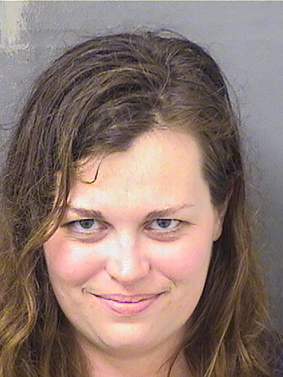 In this Jan. 31, 2020 photo provided by the Palm Beach County Sheriff's Office, Hannah Roemhild is under arrest. Roemhild, The Connecticut opera singer who drew gunfire when she smashed an SUV through security checkpoints outside President Donald Trump's Florida home is mentally ill and wasn't taking her medication before leading a trooper on a wild chase, her attorney told a judge Monday, Feb. 3, 2020. (Palm Beach County Sheriff's Office via AP)