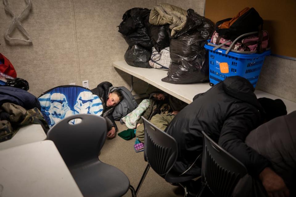 People sleep after arriving at a daytime warming centre in White Rock, B.C. run by the Engaged Communities Canada Society. 