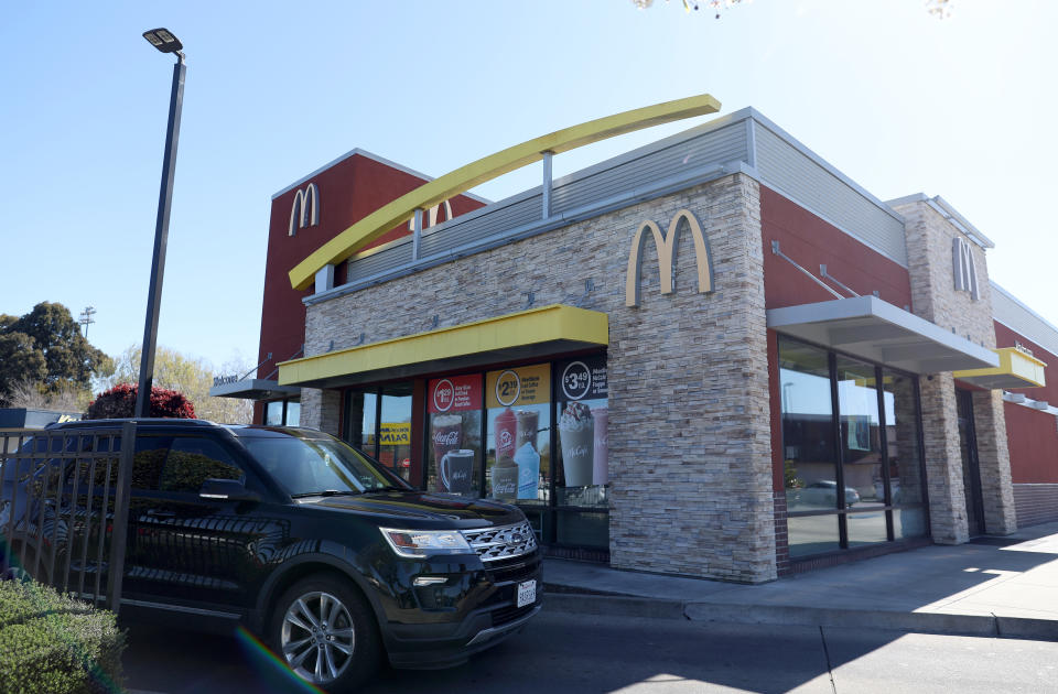 SAN PABLO, CALIFORNIA - APRIL 03: A car goes through the drive-thru at a McDonald&#39;s restaurant on April 03, 2023 in San Pablo, California. Fast food chain restaurant McDonald&#39;s is shuttering its U.S. offices this week as the company prepares to restructure and inform employees about layoffs. (Photo by Justin Sullivan/Getty Images)