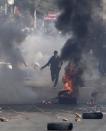 Supporters and opponents of ousted Egyptian President Mohamed Mursi clash at Nasr City district in Cairo, January 3, 2014. (REUTERS/Mohamed Abd El Ghany)