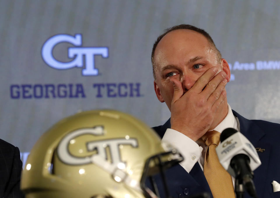 Newly hired Georgia Tech football coach Geoff Collins reacts during a news conference Friday, Dec. 7, 2018, in Atlanta. (AP Photo/John Bazemore)