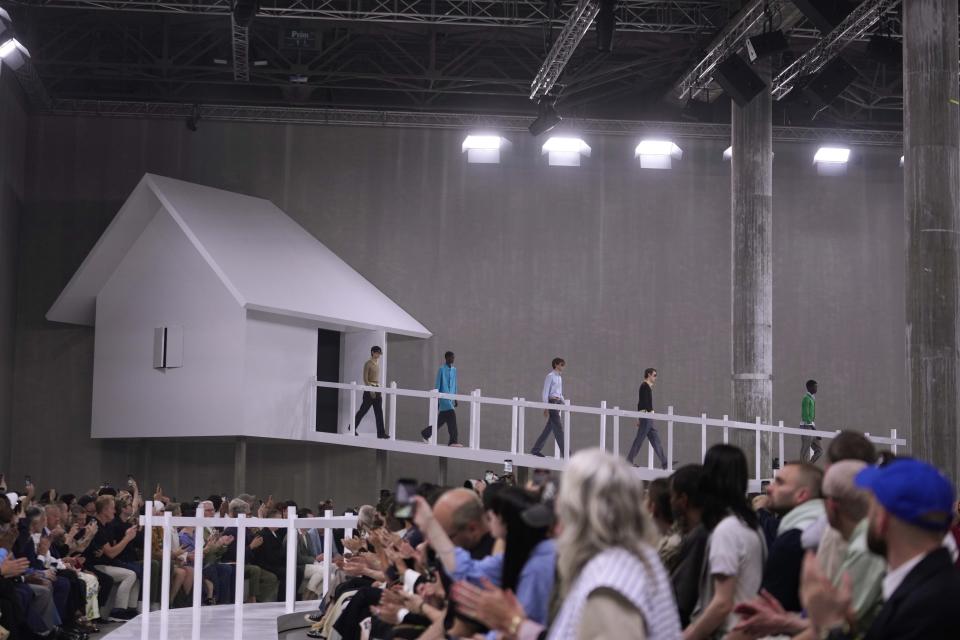 Model wear creations as part of the Prada Spring Summer 2025 collection, that was presented in Milan, Italy, Sunday, June 16, 2024. (AP Photo/Luca Bruno).