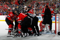 NEWARK, NJ - JUNE 09: Martin Brodeur #30 of the New Jersey Devils has his jersey pulled over his face as Devils and Los Angeles Kings players shove each other in the third period during Game Five of the 2012 NHL Stanley Cup Final at the Prudential Center on June 9, 2012 in Newark, New Jersey. (Photo by Bruce Bennett/Getty Images)