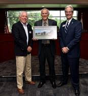 The College of Central Florida District Board of Trustees has honored recently retired Athletic Director Bob Zelinski with renaming the Newton Perry Aquatic Center to the Bob Zelinski Athletics Building. From left: CF District Board of Trustees Chair Rusty Branson, Bob Zelinski, and Jim Henningsen, CF president.