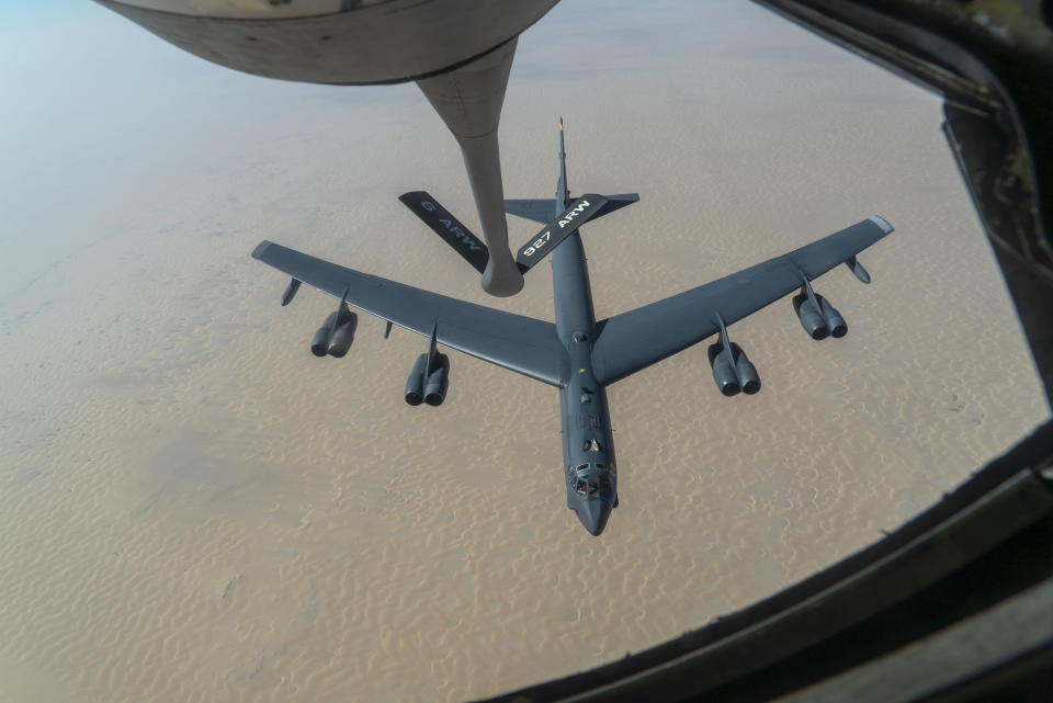 FILE - A U.S. Air Force B-52H "Stratofortress" from Minot Air Force Base, N.D., is refueled by a KC-135 "Stratotanker" in the U.S. Central Command area of responsibility, Dec. 30, 2020. Six Air Force officers who were in charge of caring for the infrastructure, fuel and logistics support for a North Dakota nuclear missile base were relieved of command due to a loss of confidence in their ability to carry out their responsibilities, the Air Force said. (Senior Airman Roslyn Ward/U.S. Air Force via AP, FILE)