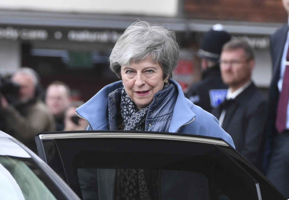 Britain's Prime Minister Theresa May leaves the Guildhall, in Salisbury, England, Monday, March 4, 2019, on the first anniversary of the Skripal poisoning. British authorities say they have completed the cleanup of the southwestern English city of Salisbury, where a former Russian spy was poisoned with a nerve agent. (Ben Birchall/PA via AP)