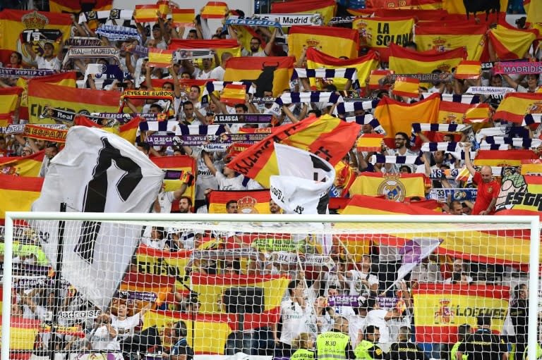 Real Madrid, whose fans are seen holding Spanish flags during a match on October 1, 2017, are seen as a symbol of Spain, which will add subtext to their away game against Girona, located in a hotbed of Catalan separatism