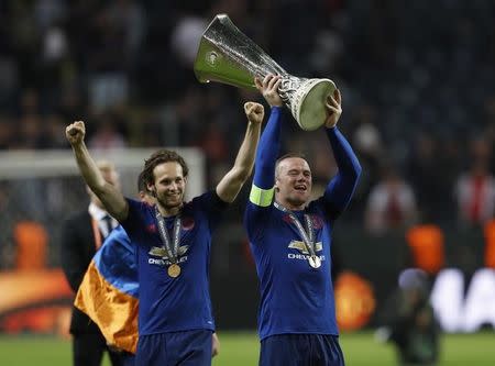 Football Soccer - Ajax Amsterdam v Manchester United - UEFA Europa League Final - Friends Arena, Solna, Stockholm, Sweden - 24/5/17 Manchester United's Wayne Rooney and Daley Blind celebrate with the trophy after winning the Europa League Reuters / Lee Smith Livepic