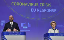 European Commission President Ursula von der Leyen, right, and European Council President Charles Michel participate in a media conference on the European Union response to the COVID-19 crisis at EU headquarters in Brussels, Wednesday, April 15, 2020. The European Union moved Wednesday to head off a chaotic and potentially disastrous easing of restrictions that are limiting the spread of the coronavirus, warning its 27 nations to move very cautiously as they return to normal life and base their actions on scientific advice. (John Thys, Pool Photo via AP)