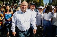 Julian LeBaron a member of the LeBaron family attends a march to protest against violence on the first anniversary of President Andres Manuel Lopez Obrador taking office, in Mexico City