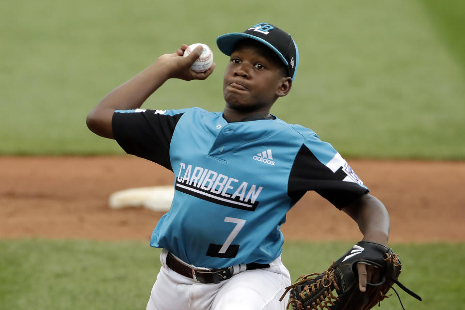 Curacao's Keven Rosina delivers during the second inning of the Little League World Series Championship game against River Ridge, Louisiana, in South Williamsport, Pa., Sunday, Aug. 25, 2019. (AP Photo/Gene J. Puskar)