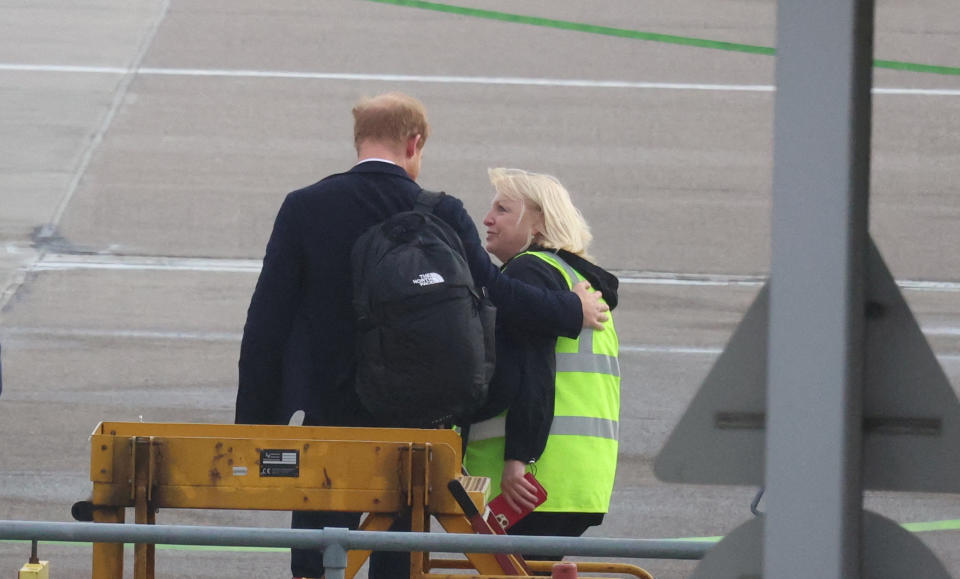 Britain's Prince Harry boards a plane at Aberdeen International Airport, following the passing of Britain's Queen Elizabeth, in Aberdeen, Britain, September 9, 2022. REUTERS/Phil Noble