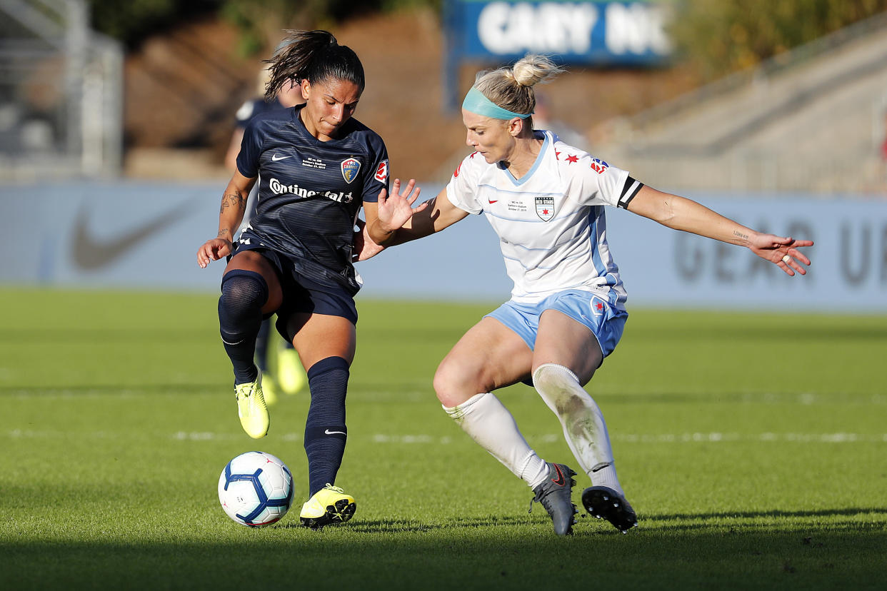 North Carolina Courage's Debinha, left, works the ball against Chicago Red Stars's Julie Ertz in the NWSL championship. Could they go to a different U.S. league? (AP Photo/Karl B DeBlaker)