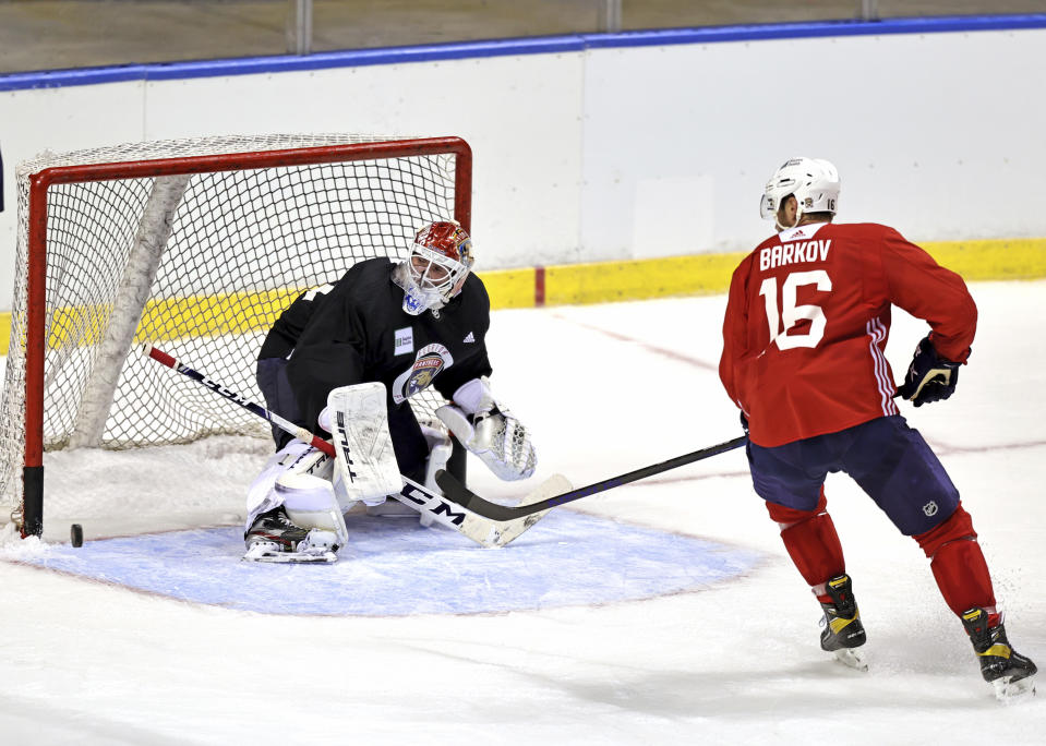 Florida Panthers goaltender Sergei Bobrovsky (72) defends the goal from Panthers center Aleksander Barkov (16) during training camp in preparation for the 2021-22 NHL season at the FLA Live Arena on Thursday, September 23, 2021 in Sunrise, Florida.(David Santiago/Miami Herald via AP)