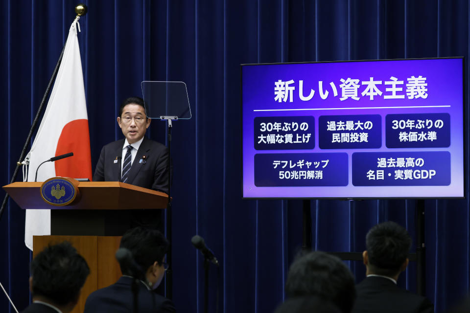 Japan's Prime Minister Fumio Kishida speaks during a news conference at his office building in Tokyo, Thursday, Nov. 2, 2023. The panel shows some financial outlines with the title, "New Capitalism," top line. (Kiyoshi Ota/Pool Photo via AP)