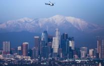 <p>Contrary to popular belief, you can spot snow from Los Angeles! The city skyline's backdrop shows a variety of gorgeous snow-capped mountains. </p>