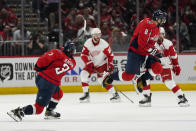 Washington Capitals left wing Alex Ovechkin (8) jumps over a shot by Washington Capitals defenseman Nick Jensen (3) in the first period of an NHL hockey game against the Detroit Red Wings, Wednesday, Oct. 27, 2021, in Washington. (AP Photo/Alex Brandon)