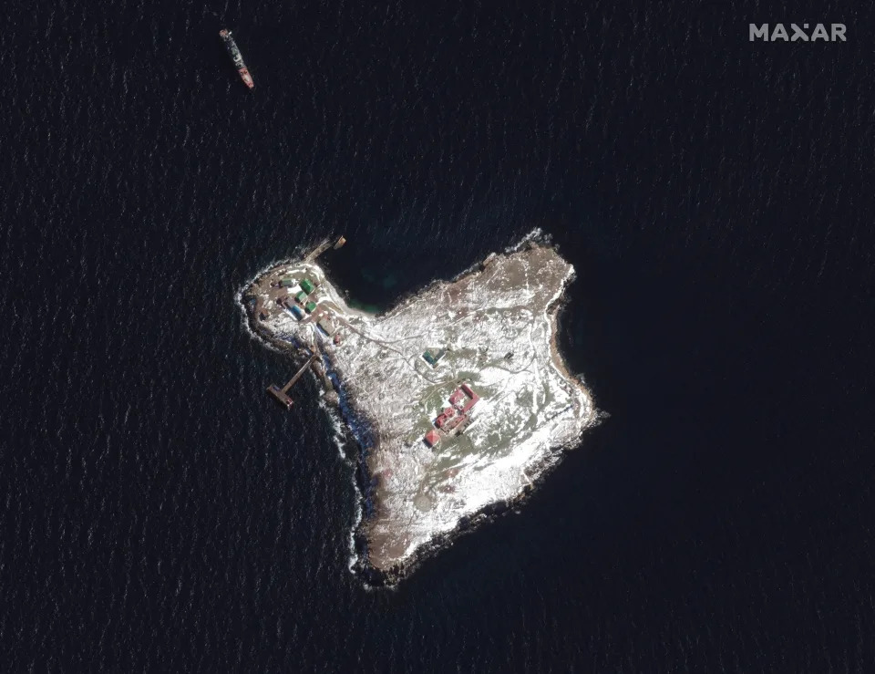 A satellite image of Snake Island and a Russian ship.