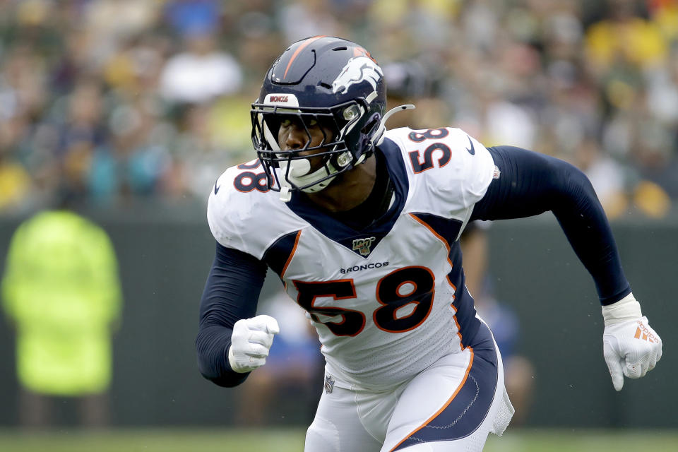 FILE - Denver Broncos outside linebacker Von Miller takes up his position during the first half of an NFL football game against the Green Bay Packers in Green Bay, Wisc., in this Sunday, Sept. 22, 2019, file photo. The Denver Broncos have exercised star linebacker Von Miller's 2021 option. The move engages the final season of the six-year, $114.5 million contract Miller signed in 2016 in the aftermath of his Super Bowl 50 MVP performance. It also guarantees him $7 million of his $17.5 million base salary. (AP Photo/Mike Roemer, File)