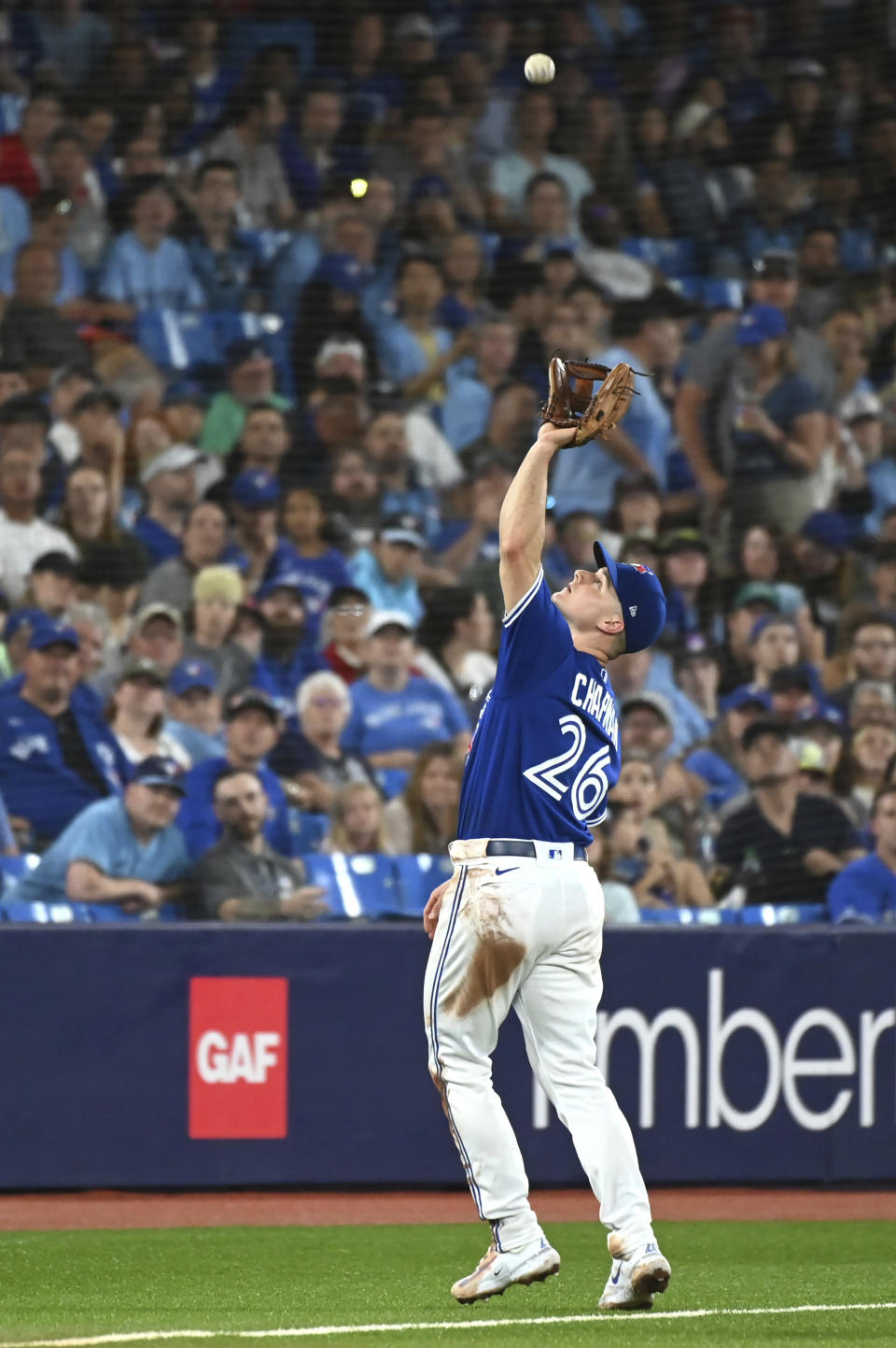 Toronto Blue Jays third baseman Matt Chapman (26) catches a fly ball off the bat of Oakland Athletics Jace Peterson in the eighth inning of a baseball game in Toronto, Saturday, June 24, 2023. (Jon Blacker/The Canadian Press via AP)