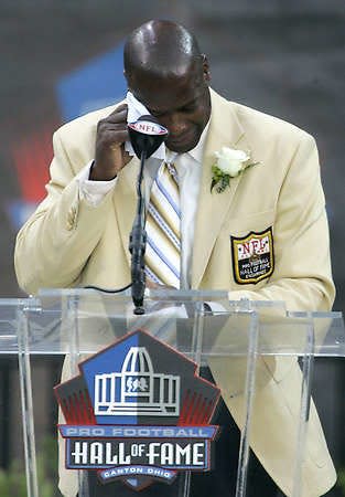 Former Washington Redskins cornerback Darrell Green wipes away his tears as he gives his speech at the Pro Football Hall of Fame Saturday.Mark Duncan | Associated Press