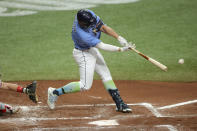 Tampa Bay Rays' Hunter Renfroe follows through on an RBI-single against the Philadelphia Phillies during the third inning of a baseball game Sunday, Sept. 27, 2020, in St. Petersburg, Fla. (AP Photo/Mike Carlson)