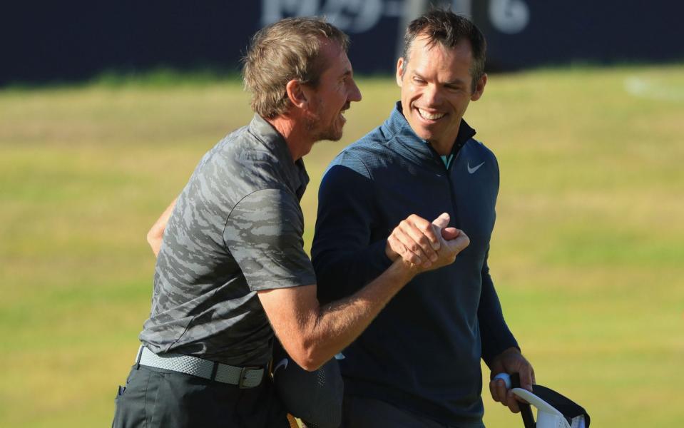 Paul Casey celebrates with his caddie John McLaren on the 18th hole  - Getty Images Europe