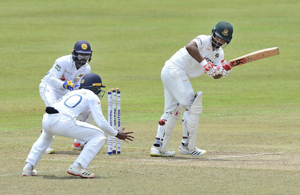 Bangladesh's Tamim Iqbal, right, plays a shot during the third day of the second cricket test match between Sri Lanka and Bangladesh in Pallekele, Sri Lanka, Sunday, May 01, 2021.( AP Photo/Sameera Peiris)