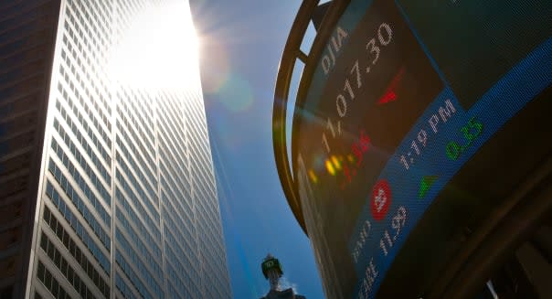 The Dow Jones Industrial Average stock market indices is displayed on an electronic board in Toronto financial district