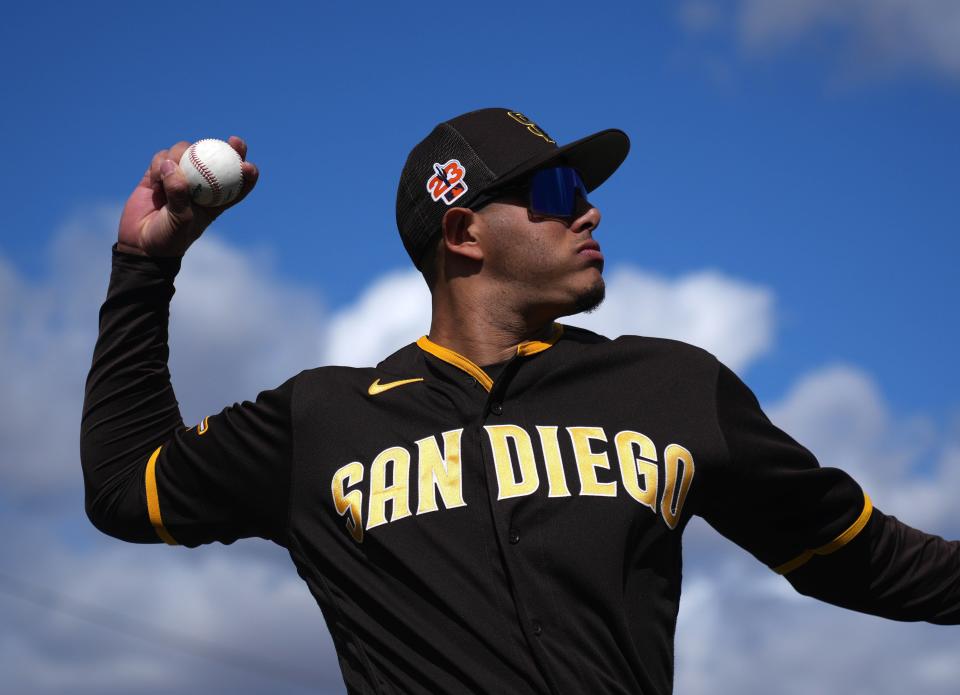 San Diego Padres third baseman Manny Machado (13) warms up prior to facing the Arizona Diamondbacks at Peoria Sports Complex on Feb. 26, 2023.