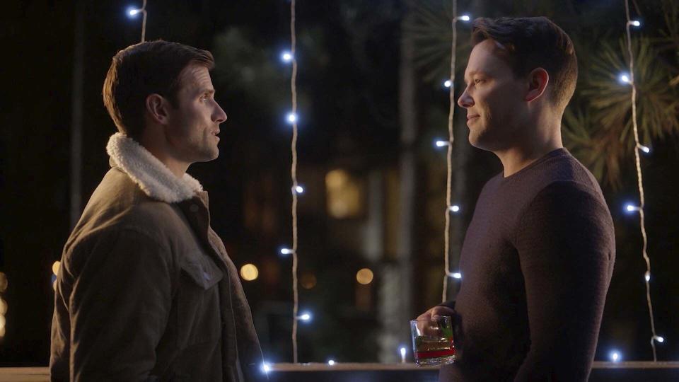 This image released by Lifetime shows Kyle Dean Massey, left, and Taylor Frey in a scene from “A Christmas to Treasure,” airing Friday, Dec. 16. (Lifetime via AP)