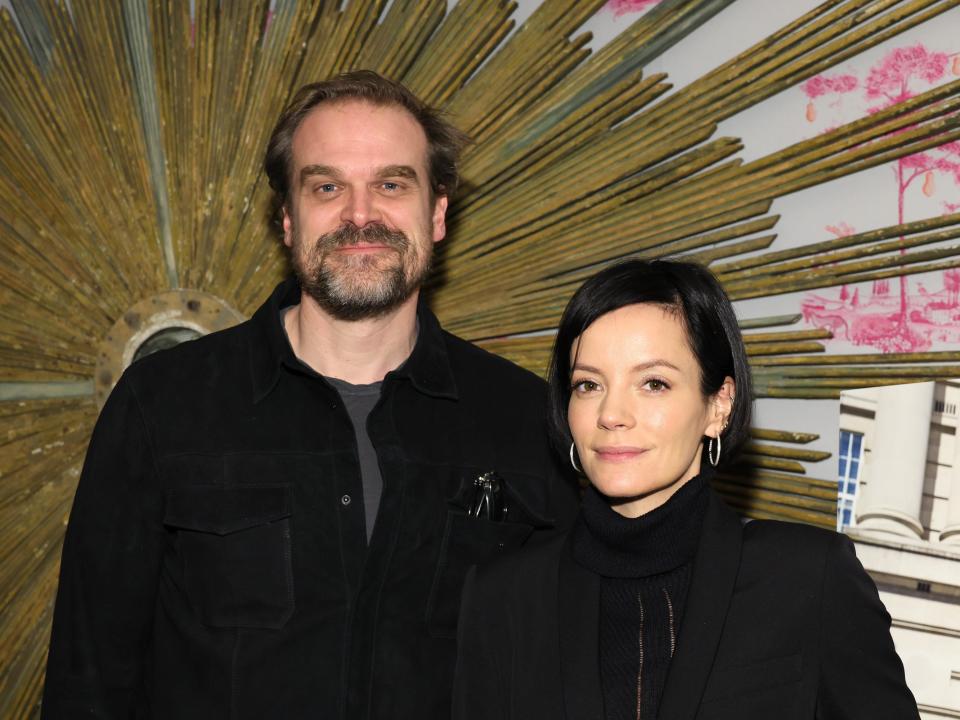 David Harbour and Lily Allen pose for photos at a 2022 event, both wearing all black.