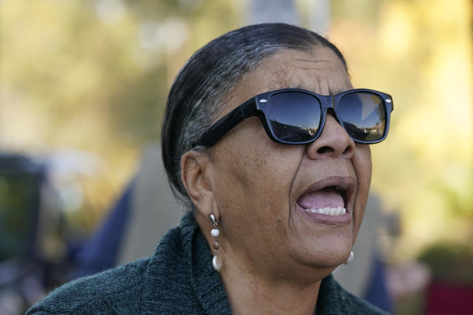 FILE - Tanya Britton, a former president of Pro-Life Mississippi, calls out through a barrier around Mississippi's only abortion clinic on Nov. 30, 2021, in Jackson, Miss. Britton often travels from her home in Tupelo, Miss., to pray outside the clinic and to try to persuade women not to go inside to end their pregnancies. Britton says it's a tragedy that the number of Black babies aborted since the Supreme Court's 1973 Roe v. Wade decision would equal the population of several large cities. She also says people are too casual about terminating pregnancies. (AP Photo/Rogelio V. Solis, File)