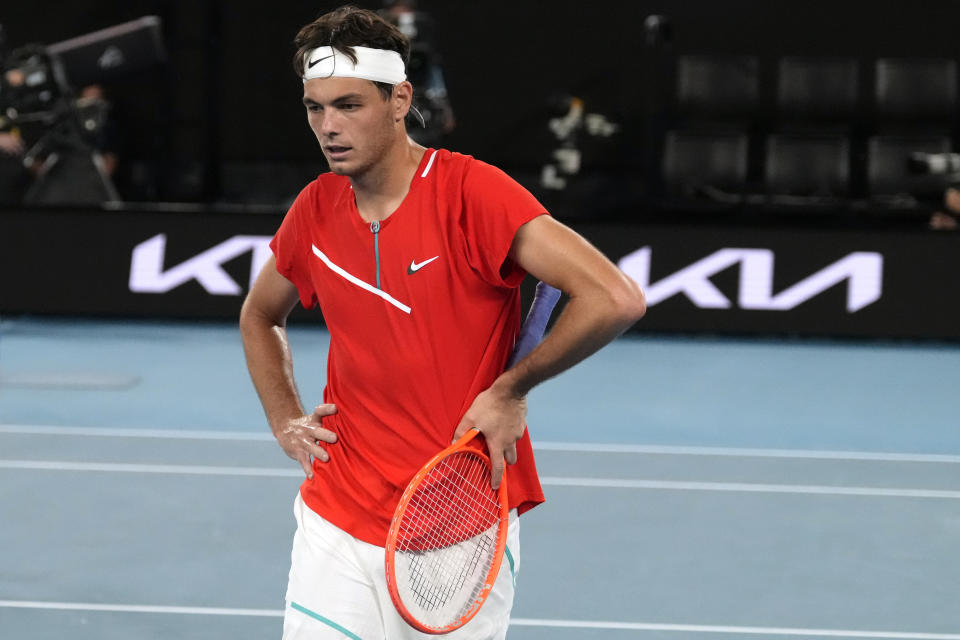 Taylor Fritz of the U.S. reacts during his fourth round match against Stefanos Tsitsipas of Greece at the Australian Open tennis championships in Melbourne, Australia, Monday, Jan. 24, 2022. (AP Photo/Simon Baker)