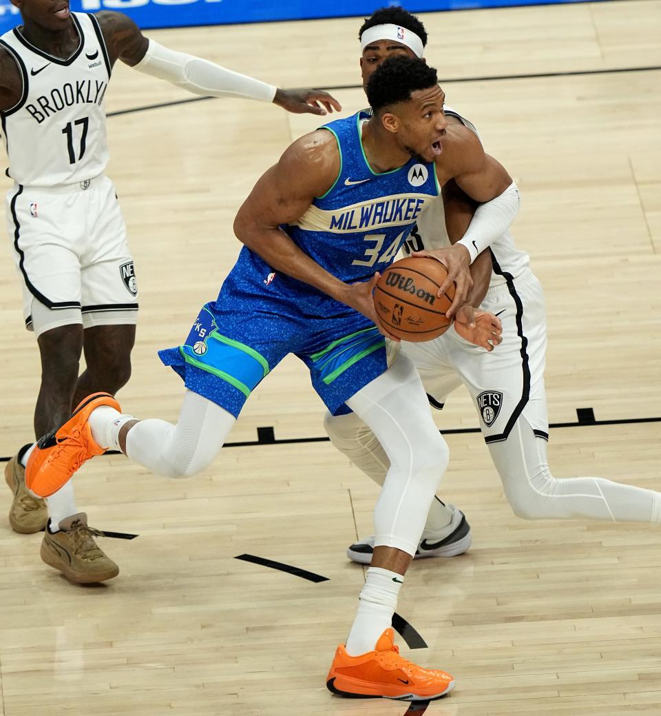 Milwaukee Bucks forward Giannis Antetokounmpo scores on Brooklyn Nets center Nic Claxton (33) during the first half of their game Thursday, March 21, 2024 at Fiserv Forum in Milwaukee, Wisconsin.



Mark Hoffman/Milwaukee Journal Sentinel