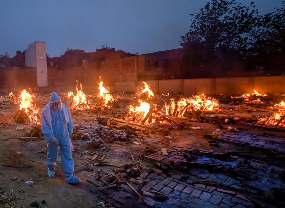 Mass cremation of COVID-19 victims and others at Old Seemapuri Cremation Ground in New Delhi on Sunday.