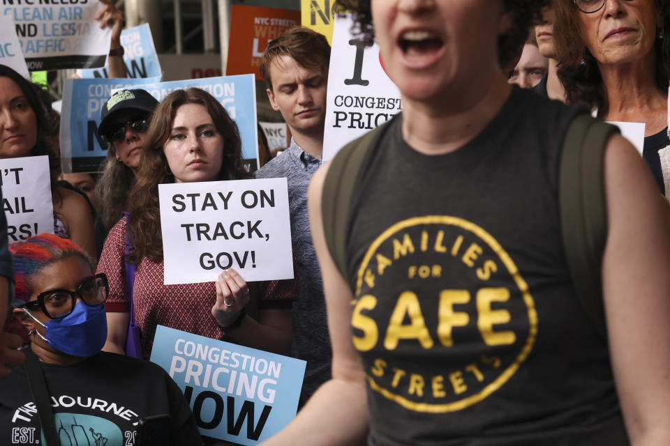 Protesters demonstrate outside New York Gov. Kathy Hochul's Manhattan office, Wednesday, June 5, 2024, in New York. Hochul is indefinitely delaying implementation of a plan to charge motorists big tolls to enter the core of Manhattan, just weeks before the nation's first "congestion pricing" system was set to launch. (AP Photo/Yuki Iwamura)