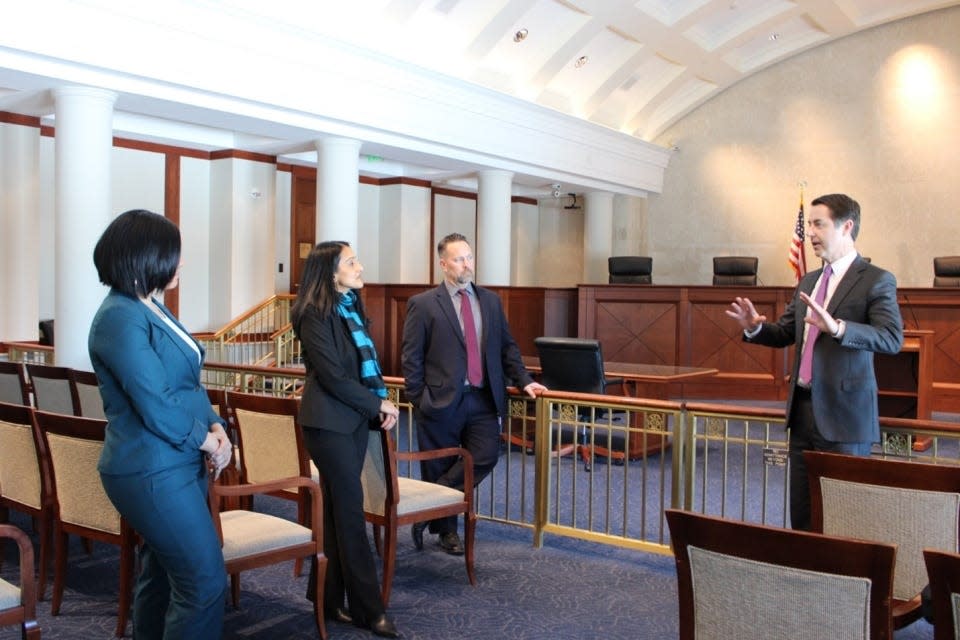 From left, Access to Justice Director Rachel Rossi and Associate Attorney General Vanita Gupta of the U.S. Department of Justice and Iowa State Public Defender Jeff Wright meet with Iowa Supreme Court Justice Matthew McDermott on Tuesday as part of the deparment's national Public Defense Day Tour.