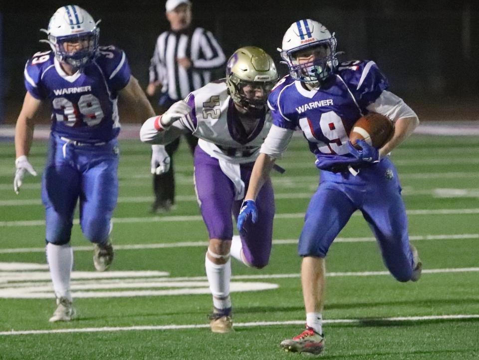 Warner's Zach Wood outruns Harding County-Bison defenders on his way to the end zone during the Monarchs 63-20 Class 9A semifinal win Friday night in Warner. Wood finished with two receiving touchdowns and a rushing touchdown.