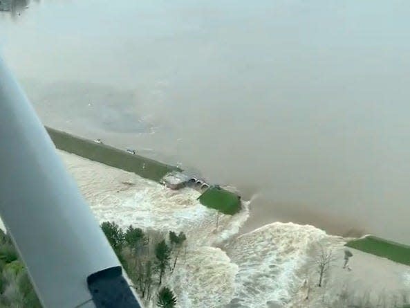 Aerial view of water from a broken Edenville Dam seen flooding the area as it flows towards Wixom Lake in Michigan, U.S. in this still frame obtained from social media video dated May 19, 2020. RYAN KALETO/via REUTERS