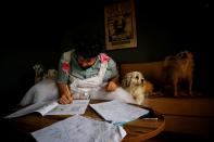 Cayan Hakiki studies for the university entrance exams at their home in Ankara