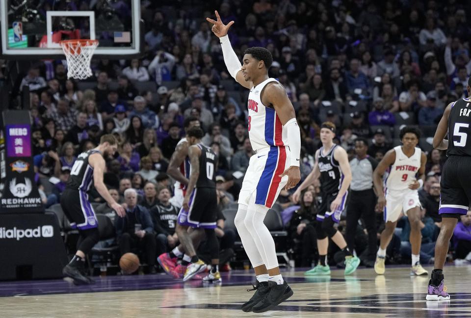 Pistons guard Jaden Ivey reacts after making a 3-point shot against the Kings in the fourth quarter of the Pistons' 133-120 win on Wednesday, Feb. 7, 2024, in Sacramento, California.
